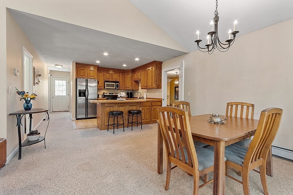 258 West Road Ashby, MA 01431 - Photo 26 of 42 a view of a dining room with furniture and chandelier