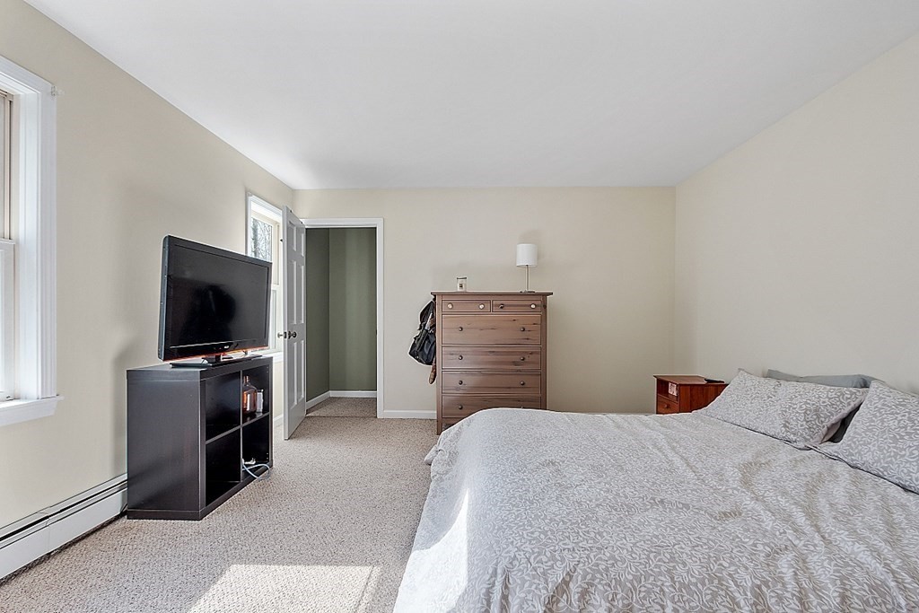 258 West Road Ashby, MA 01431 - Photo 30 of 42 a bedroom with a bed and a television in it