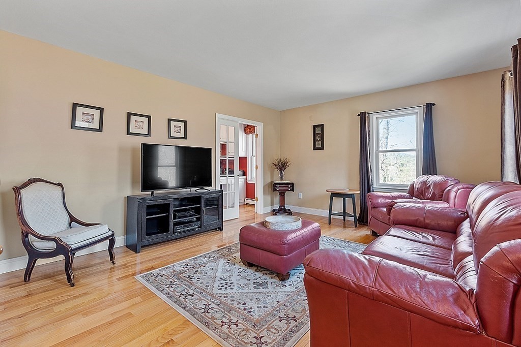 258 West Road Ashby, MA 01431 - Photo 3 of 42 a living room with furniture and a flat screen tv