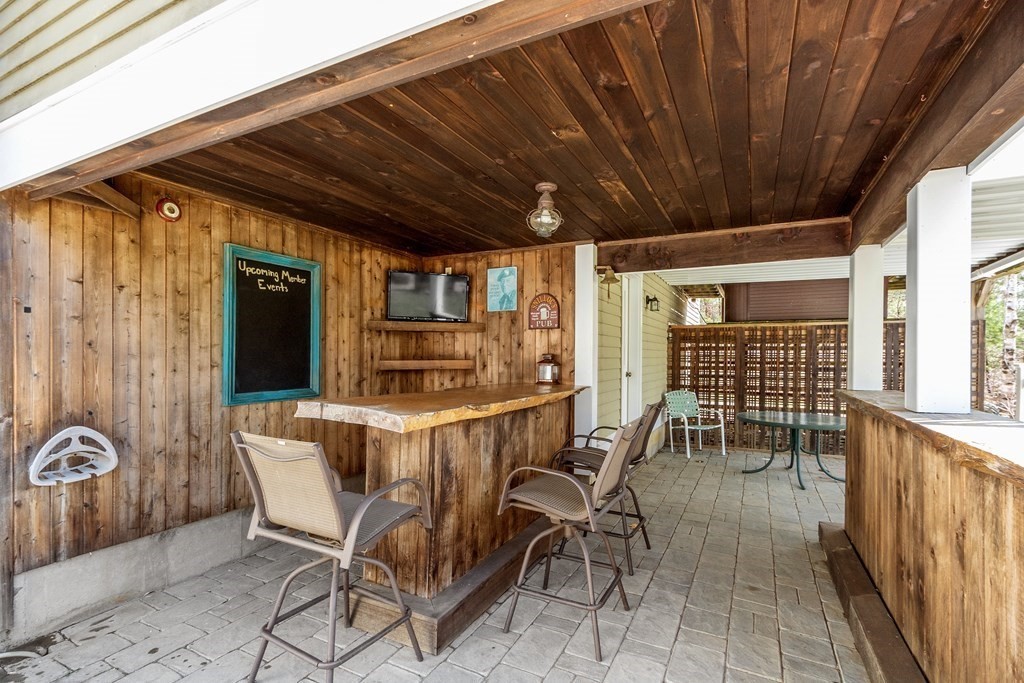 258 West Road Ashby, MA 01431 - Photo 36 of 42 a view of a patio with table and chairs and potted plants