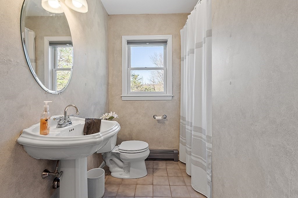 258 West Road Ashby, MA 01431 - Photo 7 of 42 a bathroom with a sink toilet and a mirror