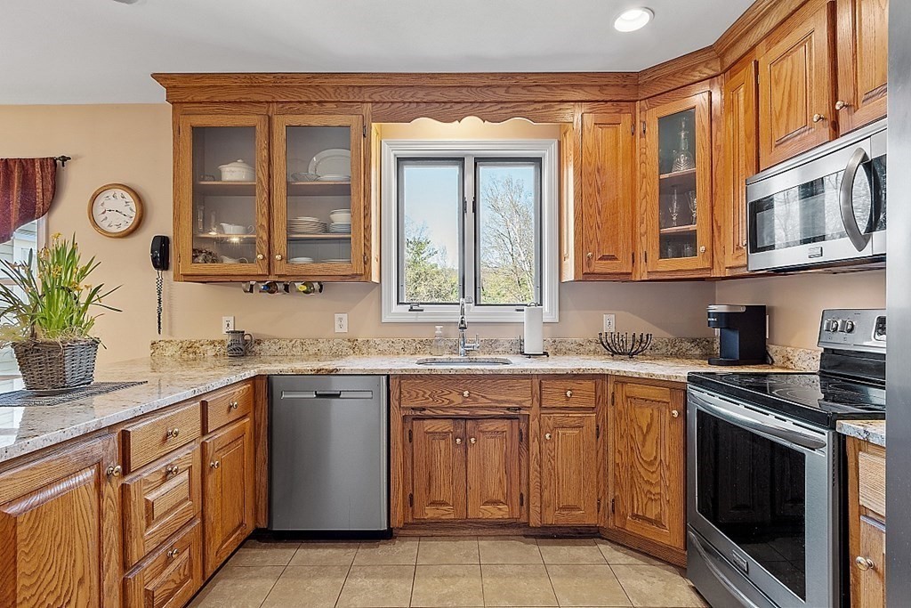 258 West Road Ashby, MA 01431 - Photo 8 of 42 a kitchen with a sink stove and cabinets