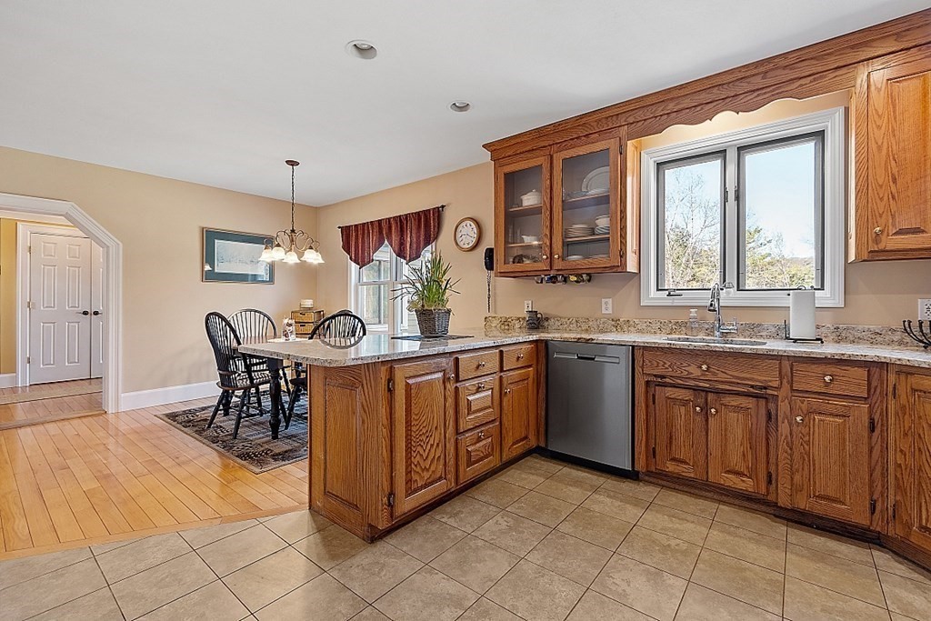 258 West Road Ashby, MA 01431 - Photo 9 of 42 a kitchen with stainless steel appliances granite countertop a sink and cabinets