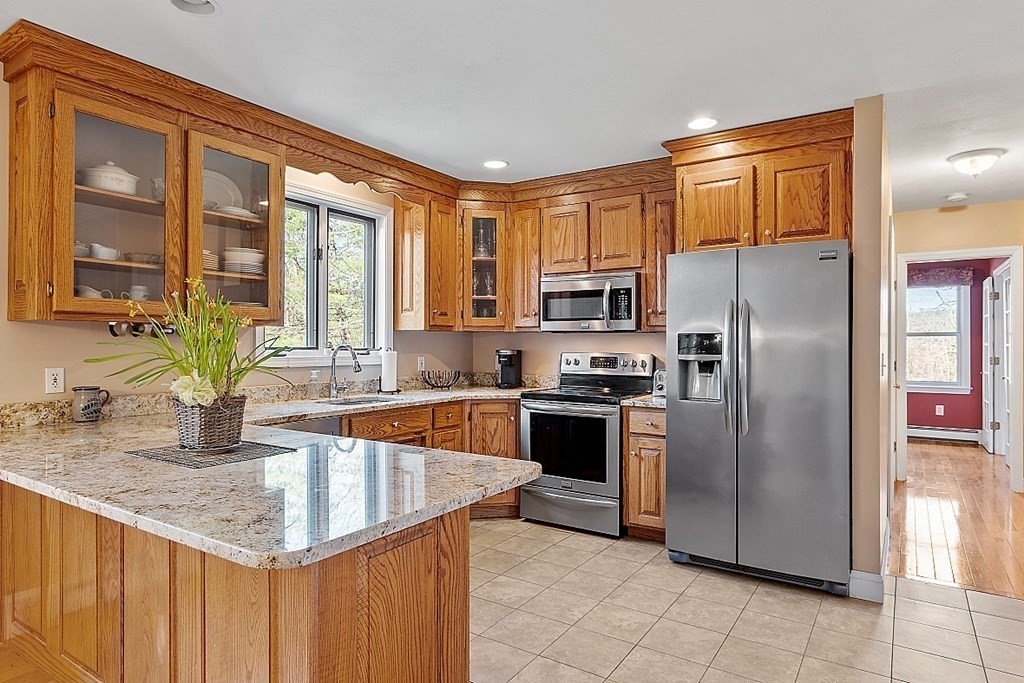 258 West Road Ashby, MA 01431 - Photo 10 of 42 a kitchen with stainless steel appliances granite countertop a refrigerator a stove and a sink