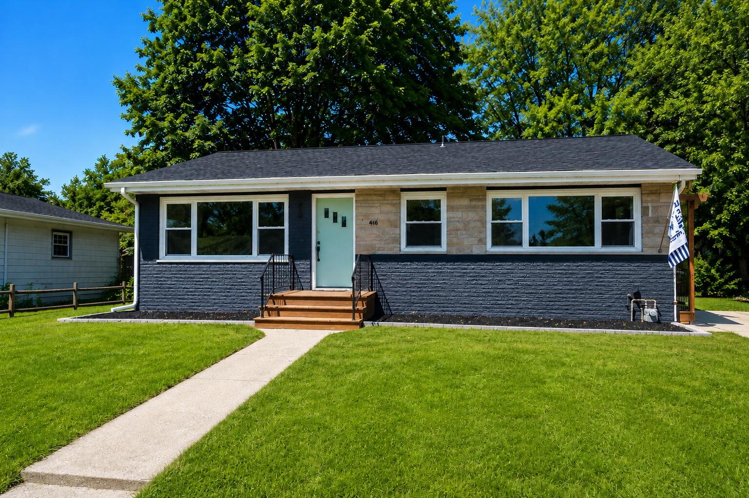 414 Holly Road Michigan City, IN 46360 - Photo 5 of 41 a front view of a house with a yard
