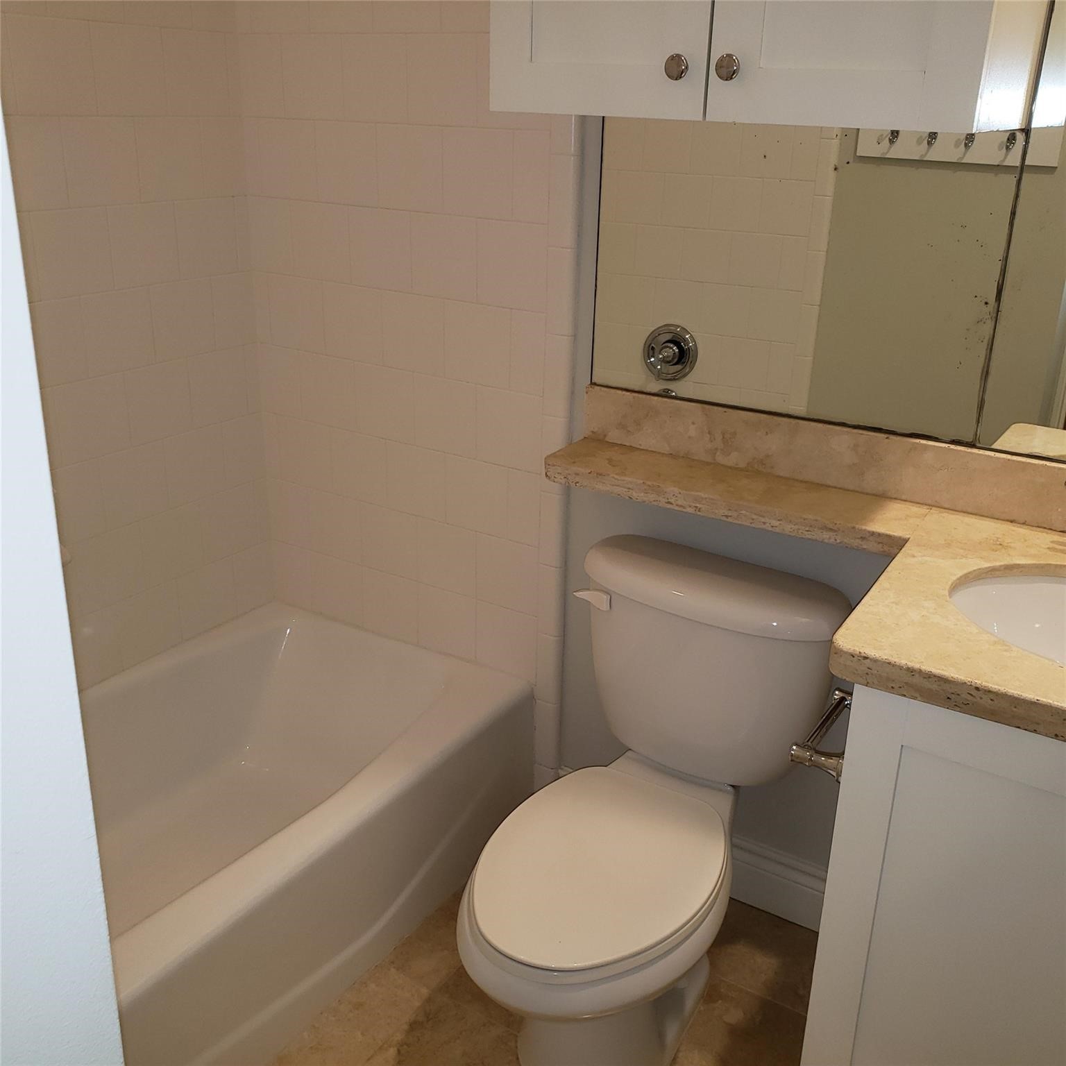 916 Lawrence Street, Unit C Houston, TX 77008 - Photo 32 of 38 a white toilet sitting next to a bath tub