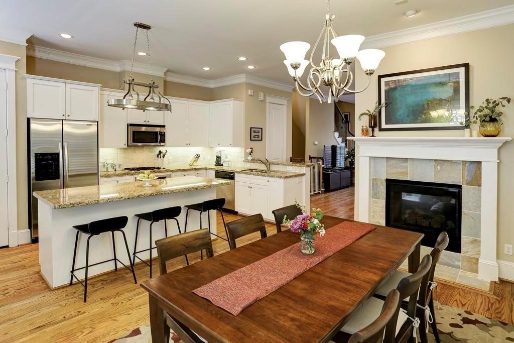 916 Lawrence Street, Unit C Houston, TX 77008 - Photo 10 of 38 a dining room with a table or chairs and a kitchen view