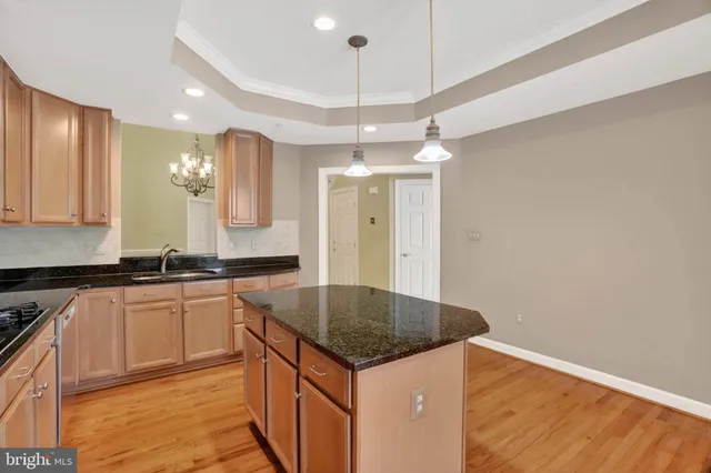 a bedroom with bed and a large window