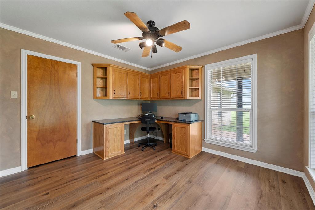 3057 Holy Road Abbott, TX 76621 - Photo 31 of 39 a kitchen with a refrigerator and wooden floors