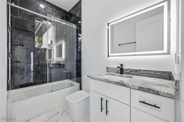 a view of kitchen with furniture and a ceiling fan