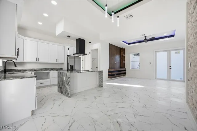 a view of a kitchen with refrigerator and microwave