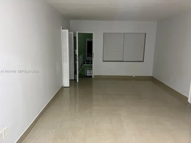 an empty room with closet