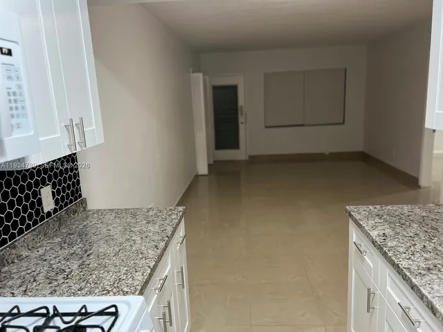 a bathroom with a toilet a sink and a mirror