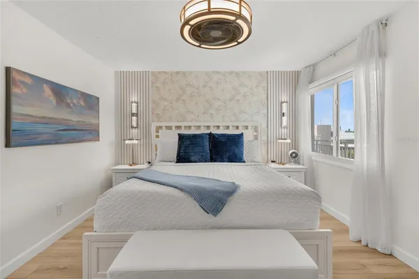a bedroom with a bed and window