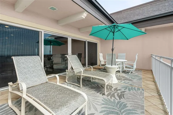 a kitchen with a table and white umbrella