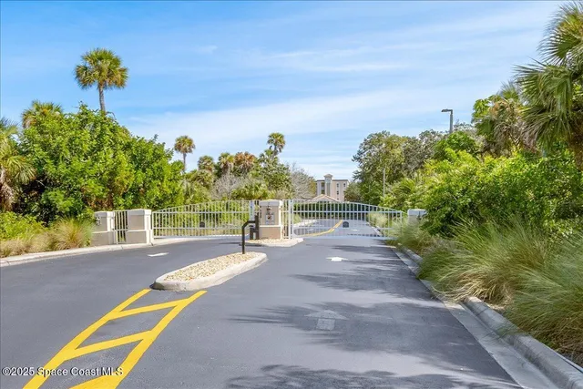 a kitchen with stainless steel appliances kitchen island granite countertop a refrigerator and a sink