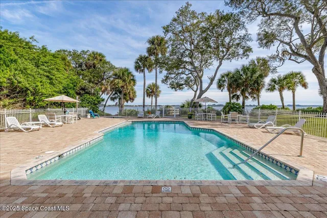 a picture of a bathroom with a shower and a mirror