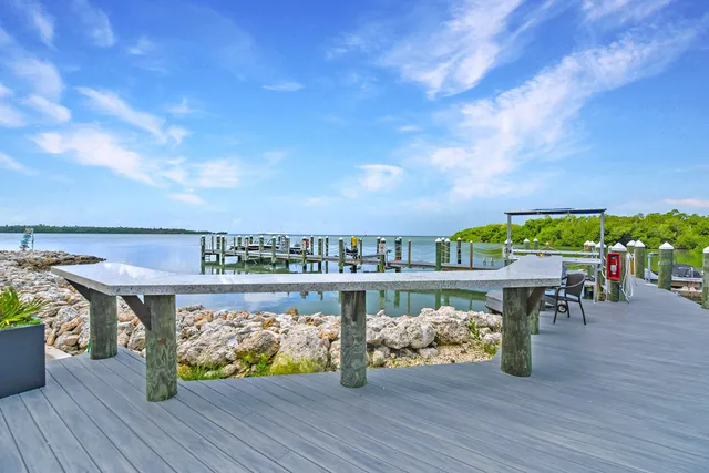 a view of a chairs and table on the wooden floor