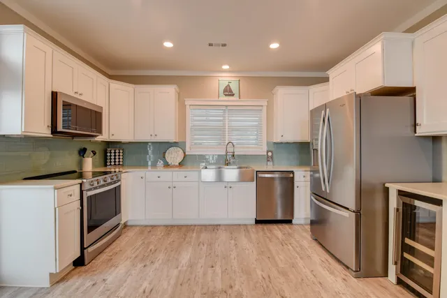 a kitchen with a refrigerator stove and microwave