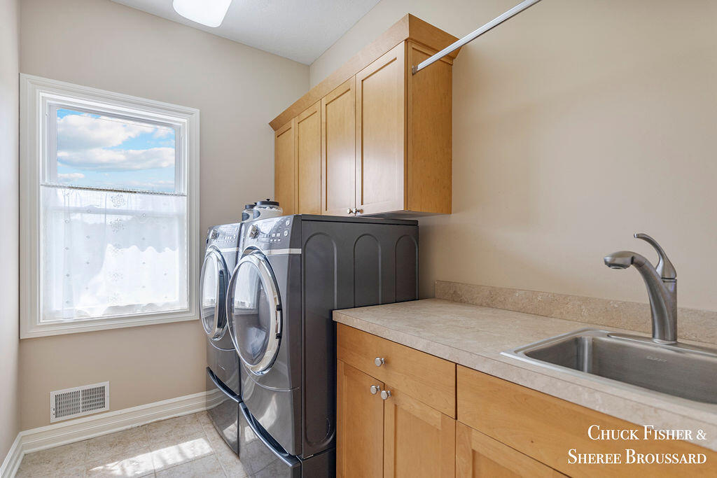 7286 Storey Book Lane Ada, MI 49301 - Photo 33 of 56 Upper Level Laundry Room