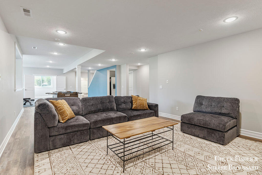 7286 Storey Book Lane Ada, MI 49301 - Photo 47 of 56 Lower Level Living Room
