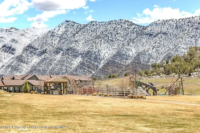 a view of a large building with an ocean