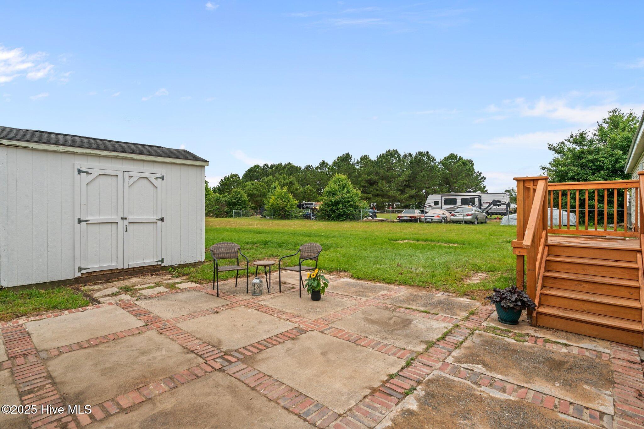 4780 Lobelia Road Vass, NC 28394 - Photo 51 of 55 Patio and Deck w/ storage