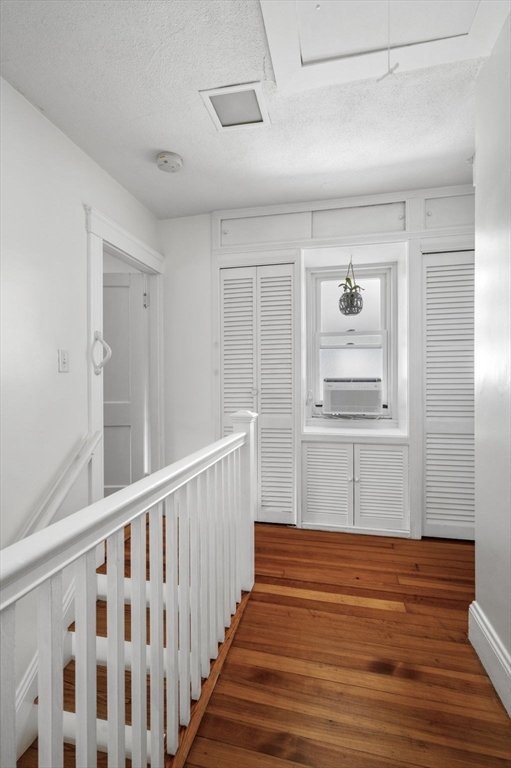 4 Edgewood Road Newton, MA 02465 - Photo 24 of 39 a view of a hallway with wooden floor and windows