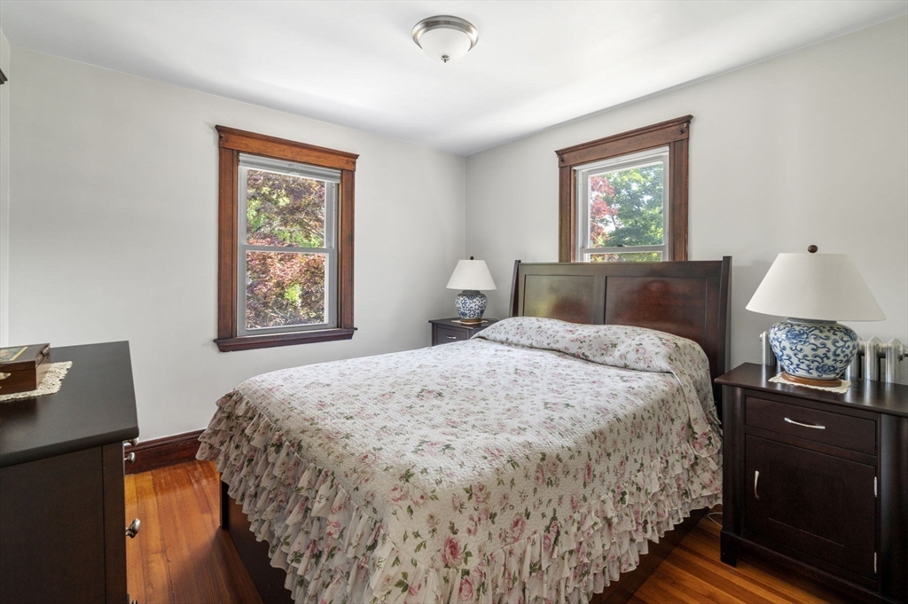 4 Edgewood Road Newton, MA 02465 - Photo 28 of 39 a bedroom with a bed and a lamp on dresser
