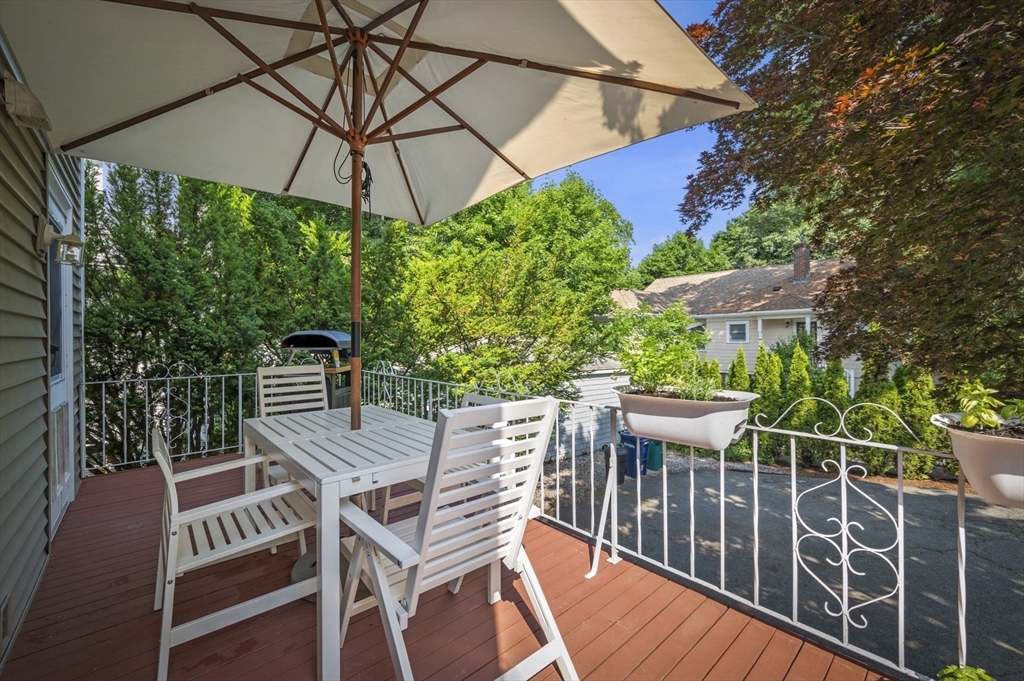 4 Edgewood Road Newton, MA 02465 - Photo 31 of 39 a view of a patio with table and chairs under an umbrella