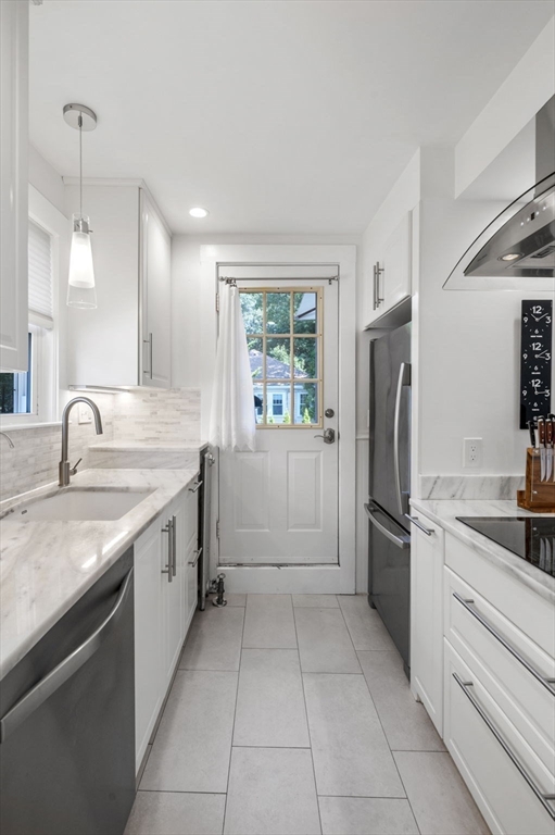 4 Edgewood Road Newton, MA 02465 - Photo 8 of 39 a kitchen with a refrigerator sink and cabinets