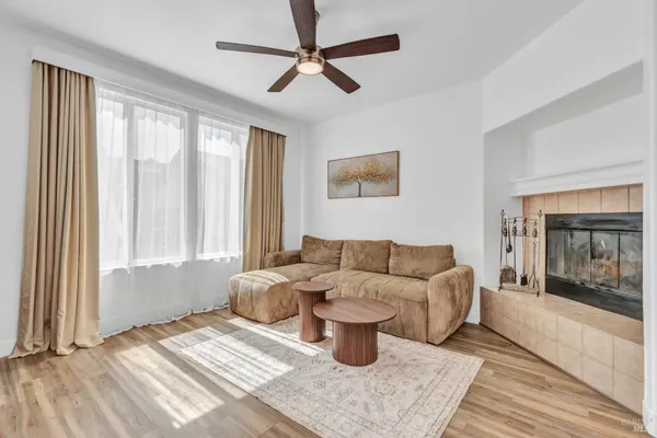 a living room with furniture and a fireplace