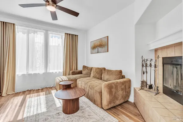 a living room with furniture and a window