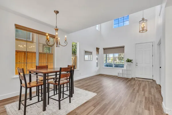 a view of a dining room with furniture window and wooden floor