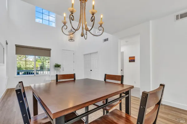 a view of a dining room with furniture and window
