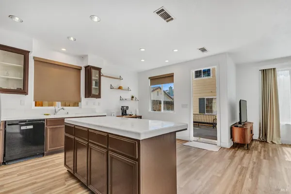a kitchen with a sink stove and refrigerator