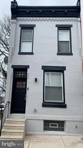 a view of fireplace and window