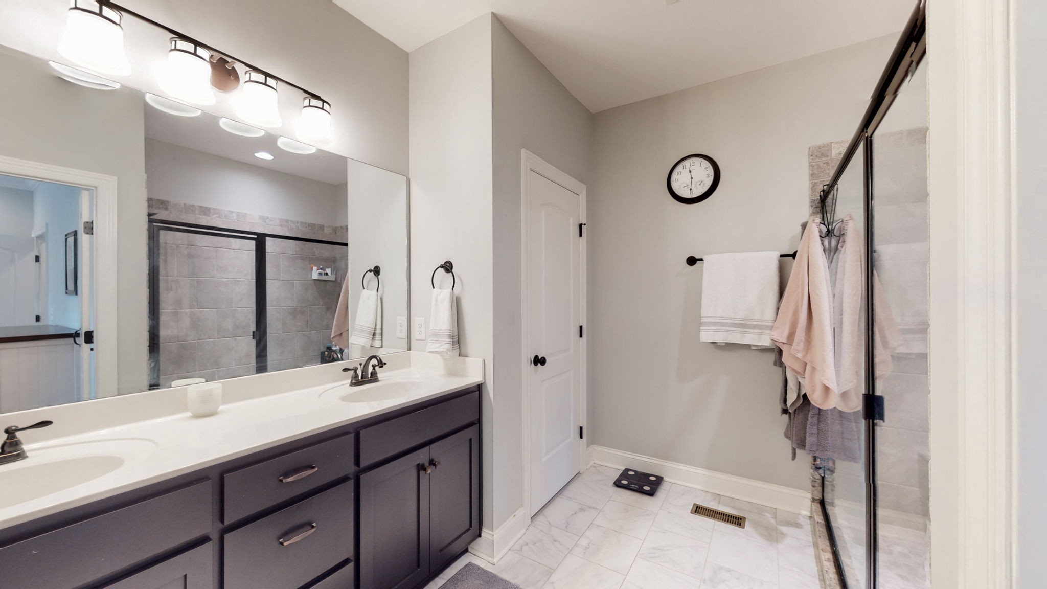 650 Burford Road Lebanon, TN 37087 - Photo 16 of 50 a bathroom with a tub sink double vanity and a mirror