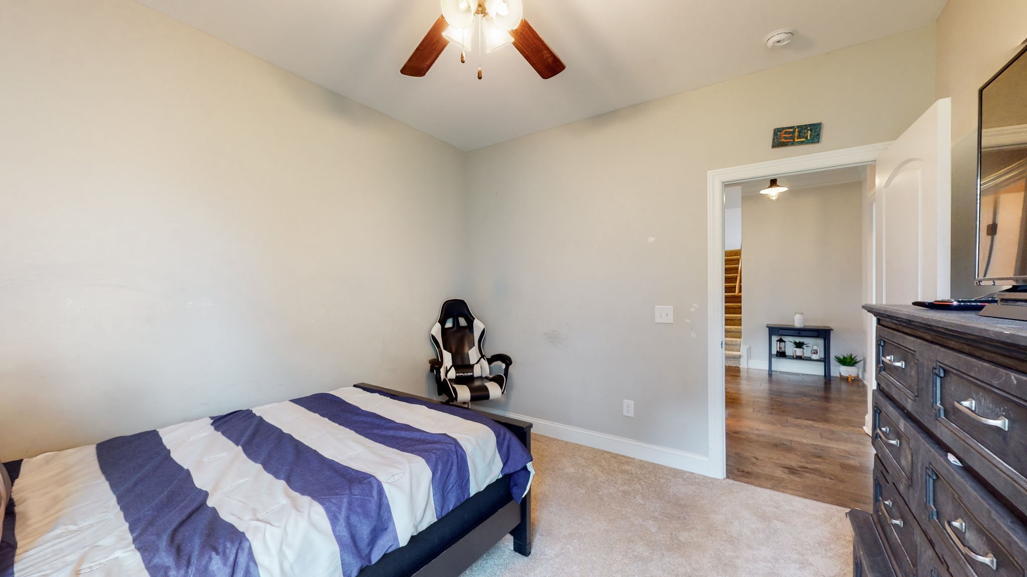 650 Burford Road Lebanon, TN 37087 - Photo 24 of 50 a bedroom with a bed and a chandelier