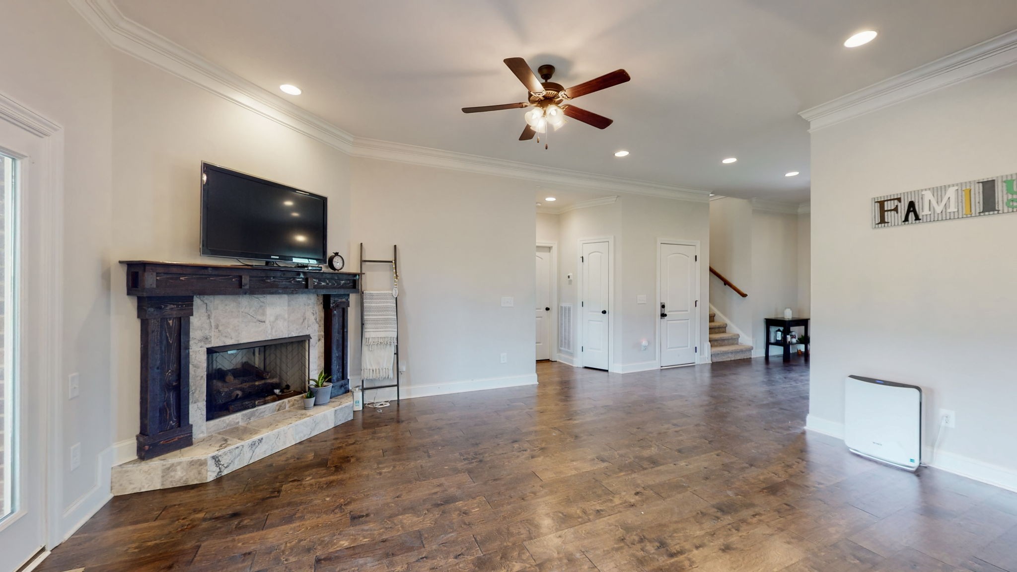 650 Burford Road Lebanon, TN 37087 - Photo 6 of 50 a view of an empty room with wooden floor fireplace and a window