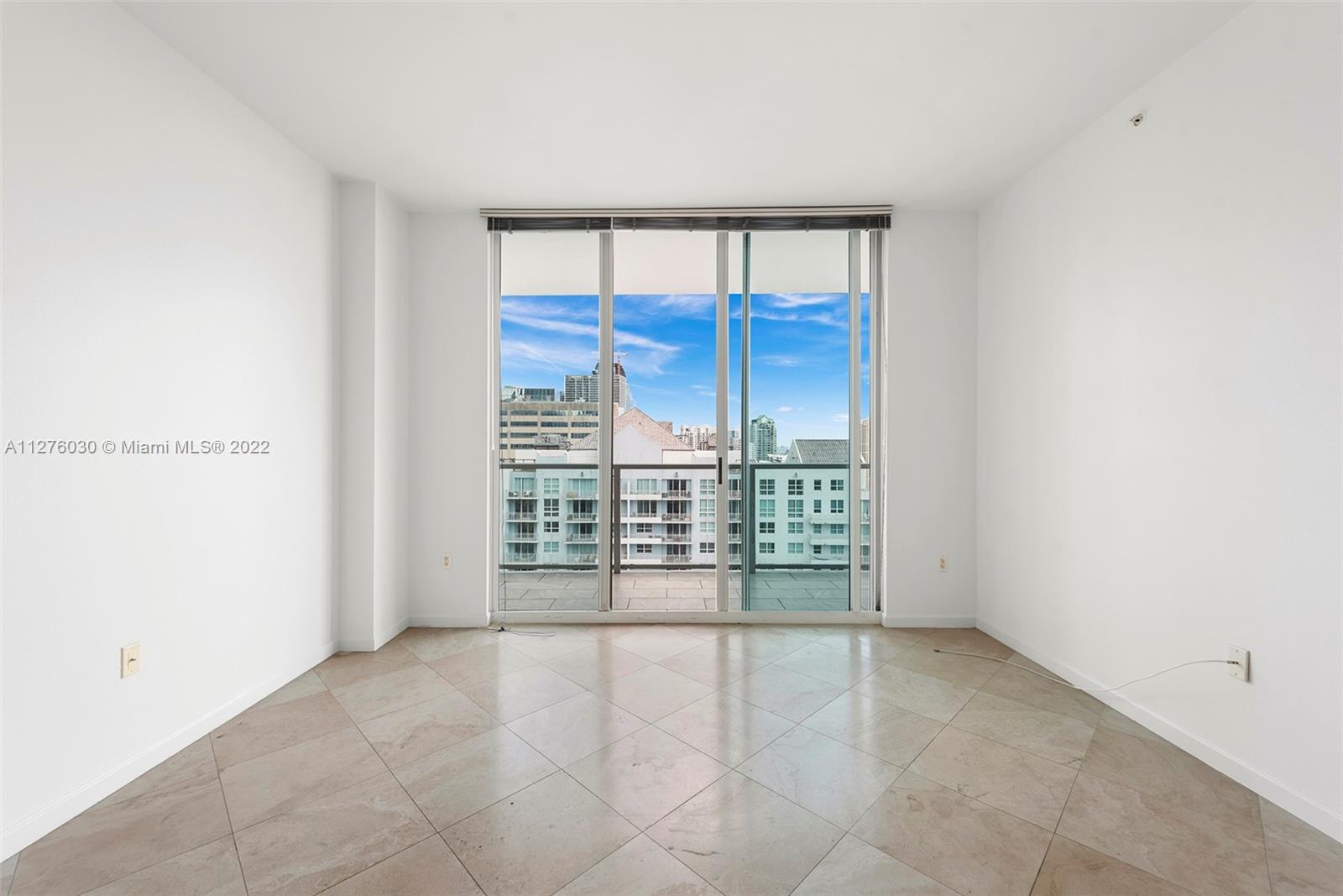1155 Brickell Bay Drive, Unit PH104 Miami, FL 33131 - Photo 15 of 33 a view of an empty room with a window