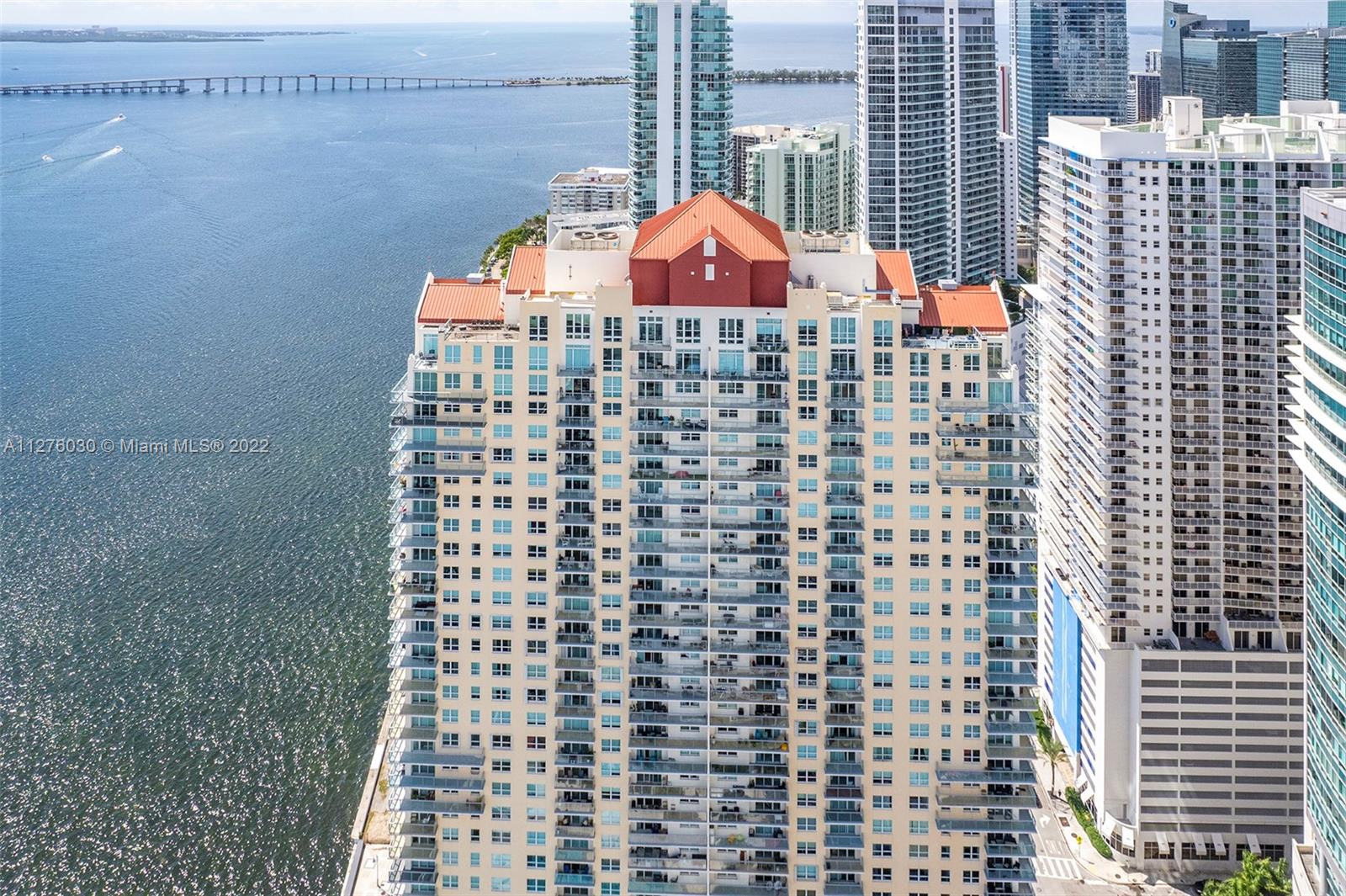 1155 Brickell Bay Drive, Unit PH104 Miami, FL 33131 - Photo 28 of 33 a view of a balcony with a bench