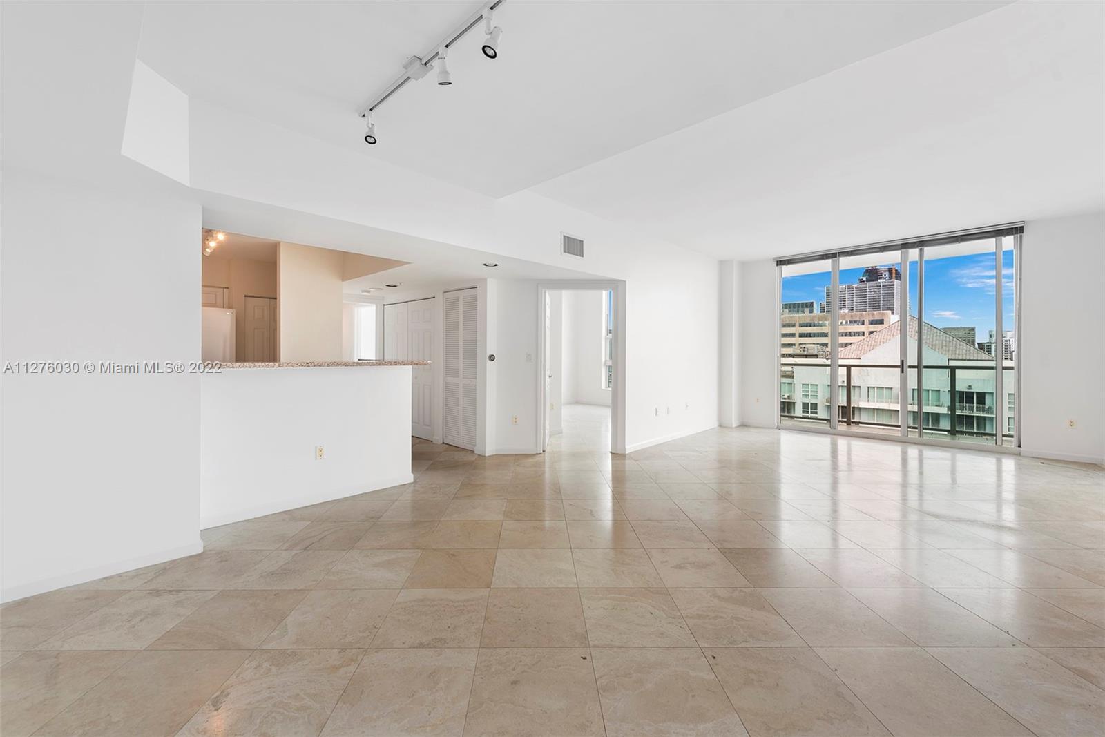 1155 Brickell Bay Drive, Unit PH104 Miami, FL 33131 - Photo 3 of 33 a view of an empty room with a window