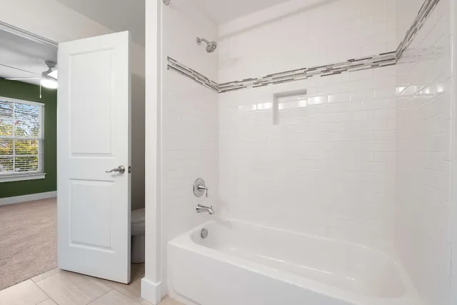 a bathroom with a shower and a tub