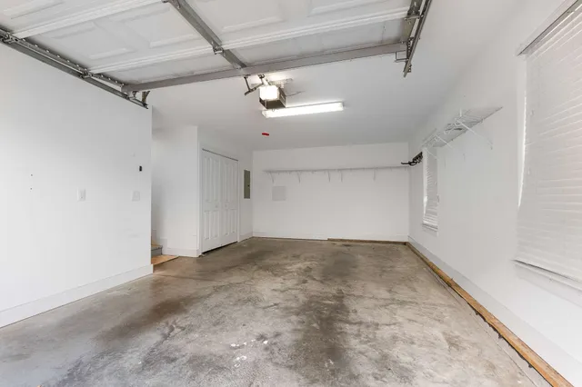 a view of a big room with a ceiling fan