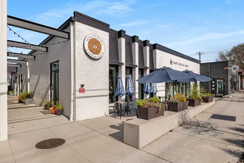 a view of a street with sitting area