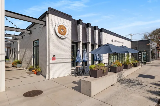 a view of a street with sitting area