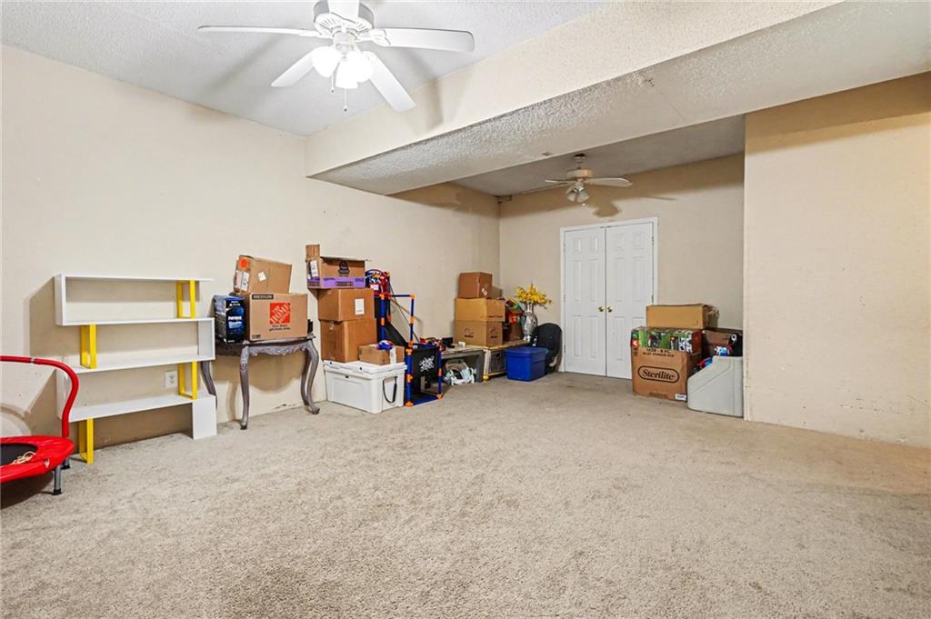 2530 Rockbridge Road Northwest Conyers, GA 30012 - Photo 27 of 45 a view of a room with furniture and a chandelier