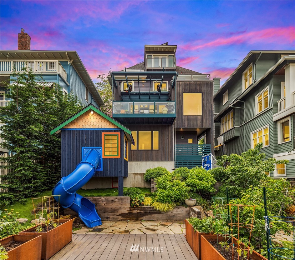 1618 37th Avenue Seattle, WA 98122 - Photo 1 of 39 a front view of a house with a yard