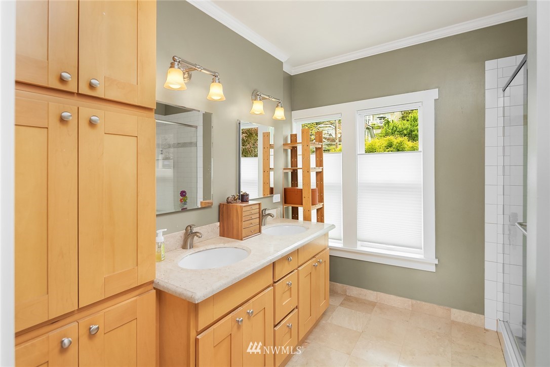 1618 37th Avenue Seattle, WA 98122 - Photo 17 of 39 a bathroom with a sink and a mirror